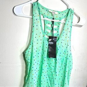 Light green 100%polyester summer top beautiful detail back.